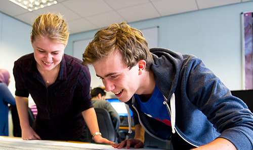 Tutor and prospective student observing surface